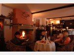 Sitting by Fireplace